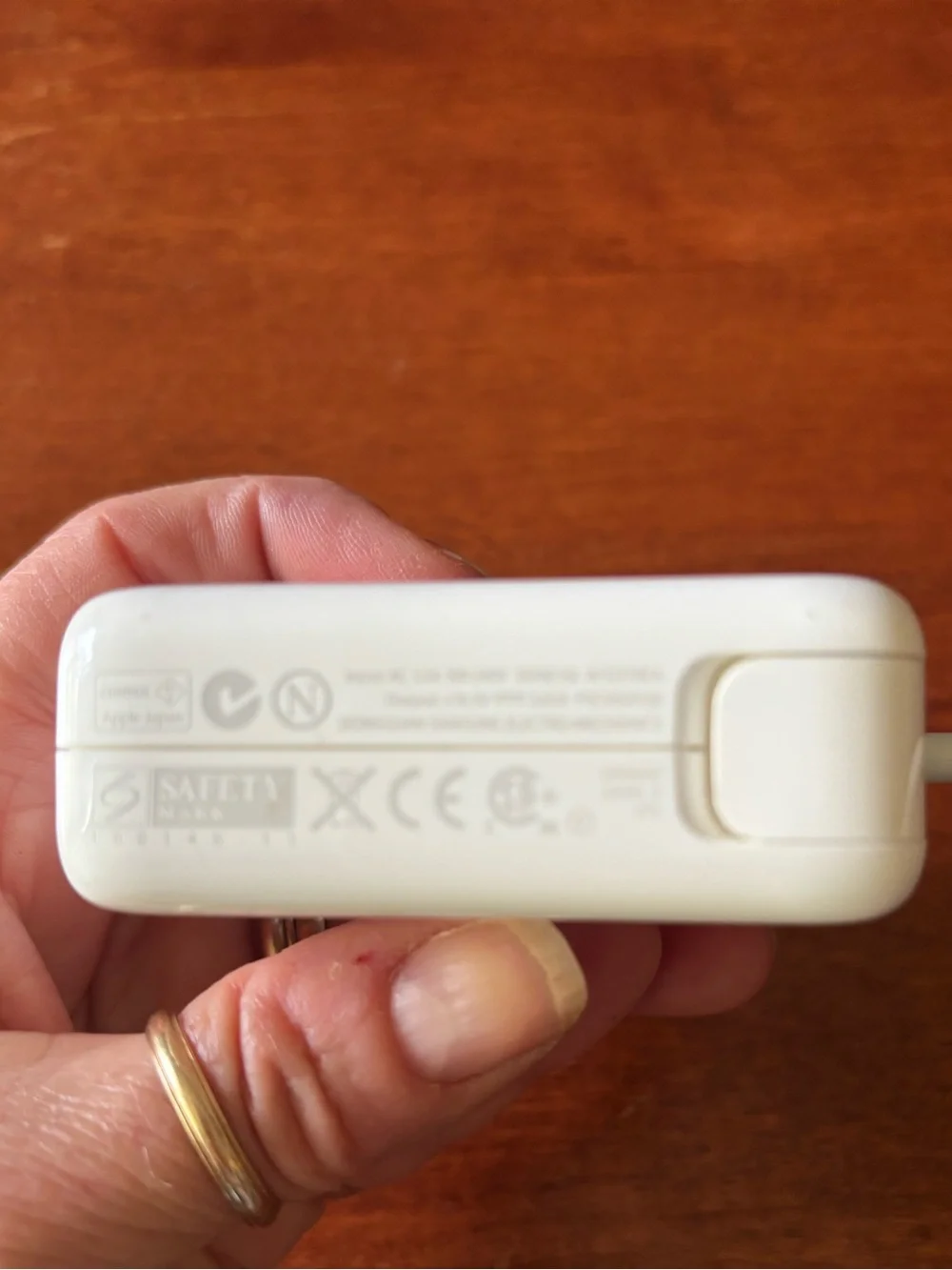 Apple MagSafe power adapter with a fold-out wall plug duckhead attachment